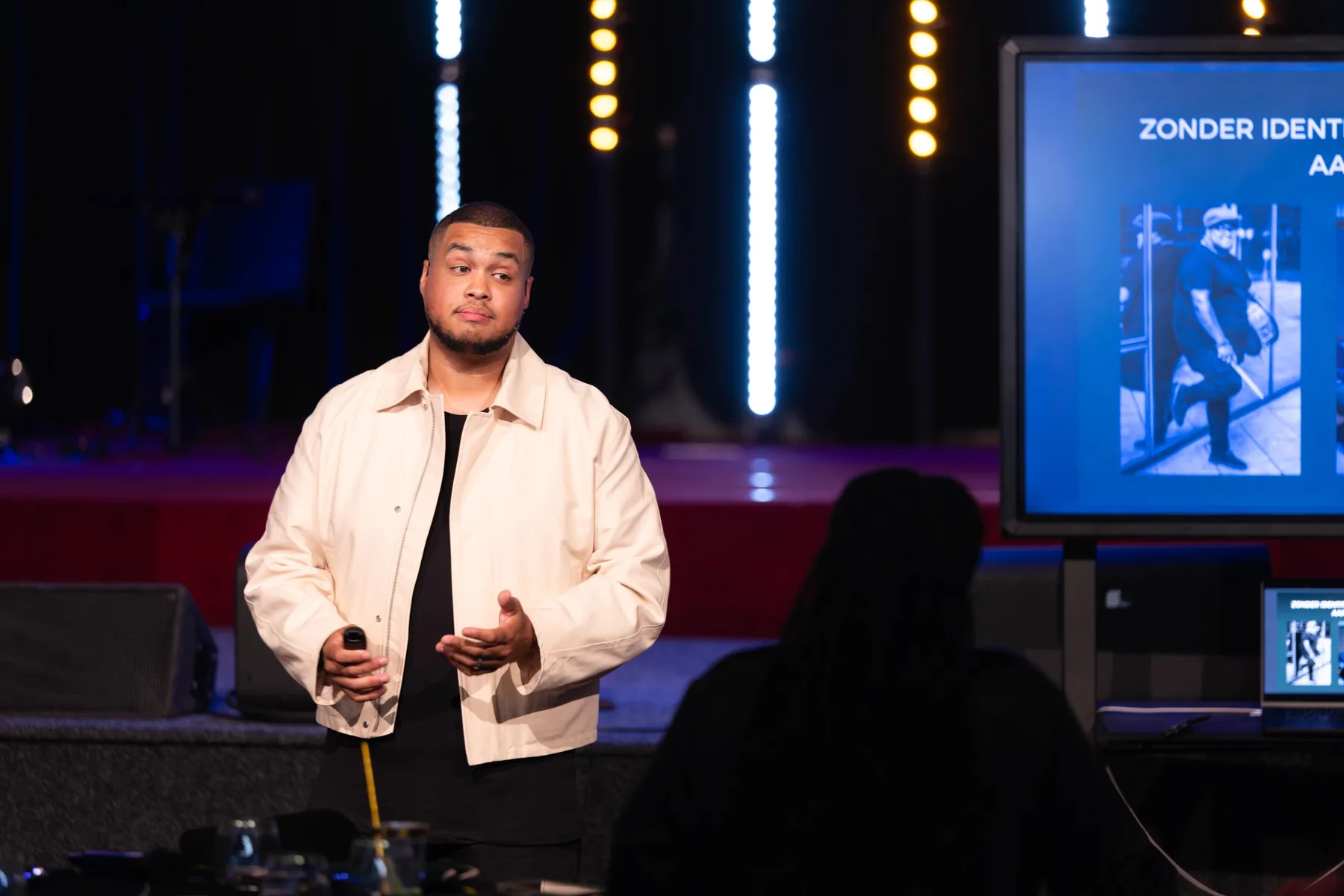 Jefren speaking on stage